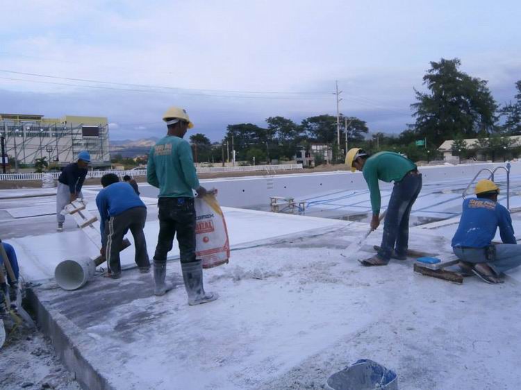 Application of pebble wash out on the extended walkway of the Olympic Pool Wow World Subic Bay